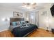 Spacious bedroom with hardwood floors and a wooden headboard at 7674 Stuart St, Westminster, CO 80030