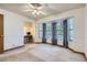 Large bedroom with bay window, and a built-in desk with chair off to one side at 8136 Washington St # 141, Denver, CO 80229