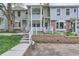 Charming townhome with brick and siding exterior, complemented by a well-maintained front yard at 8136 Washington St # 141, Denver, CO 80229