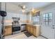 Bright kitchen features stainless steel appliances, and white countertops with a stainless steel dishwasher at 8136 Washington St # 141, Denver, CO 80229
