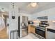 Well-lit kitchen with stainless steel appliances and white cabinets at 8136 Washington St # 141, Denver, CO 80229
