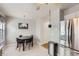 Eat-in kitchen featuring stainless steel appliances and a dining area at 8136 Washington St # 141, Denver, CO 80229