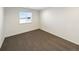 Neutral bedroom with carpet, a window for natural light, and white walls at 3520 Little Bell Dr, Frederick, CO 80516