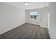 Neutral bedroom with soft carpet, large windows, and a closet for storage at 3520 Little Bell Dr, Frederick, CO 80516