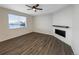 Cozy living room featuring a modern fireplace, neutral walls, and ample natural light at 3520 Little Bell Dr, Frederick, CO 80516