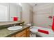 Well-lit bathroom features a granite counter, updated fixtures, and tiled shower and tub at 610 S Clinton St # 3D, Denver, CO 80247