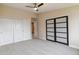 Neutral bedroom with modern closet doors, ceiling fan and carpet at 610 S Clinton St # 3D, Denver, CO 80247