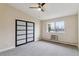 Bright bedroom with modern closet doors, ceiling fan and window at 610 S Clinton St # 3D, Denver, CO 80247