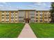 Inviting exterior view of the building with well-maintained lawn and entryway, creating a welcoming first impression at 610 S Clinton St # 3D, Denver, CO 80247