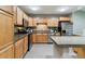 A well-equipped kitchen showcases wood cabinets, stone countertops, and stainless steel appliances at 610 S Clinton St # 3D, Denver, CO 80247