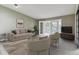 Comfortable living room featuring a neutral color palette, balcony access, and plush seating at 610 S Clinton St # 3D, Denver, CO 80247