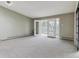 Spacious living room with a large window and sliding doors to a balcony, offering ample natural light at 610 S Clinton St # 3D, Denver, CO 80247