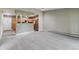 An open-concept layout combines living and kitchen areas, featuring neutral tones and carpet flooring at 610 S Clinton St # 3D, Denver, CO 80247
