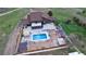 Aerial shot of backyard with pool, patio, and landscaped areas at 1063 Clarke Ct, Castle Rock, CO 80109