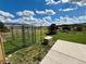 Large backyard with a playground, animal pen, and mature landscaping at 1063 Clarke Ct, Castle Rock, CO 80109