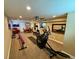 Finished basement with gym equipment, dining table, and cozy seating area, offering versatile space for various activities at 1063 Clarke Ct, Castle Rock, CO 80109
