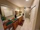 Dual sink bathroom offers ample counter space, extra storage, and a convenient washer and dryer closet at 1063 Clarke Ct, Castle Rock, CO 80109