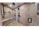 Luxurious bathroom featuring a modern, multi-head shower with seating at 1063 Clarke Ct, Castle Rock, CO 80109