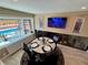 Dining area with views to the pool and backyard with seating for four at 1063 Clarke Ct, Castle Rock, CO 80109