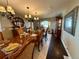 Elegant dining room featuring a large table with seating for eight and chandelier lighting at 1063 Clarke Ct, Castle Rock, CO 80109