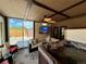Relaxing sunroom featuring a hot tub, comfortable seating, and view to the backyard, creating a private oasis at 1063 Clarke Ct, Castle Rock, CO 80109