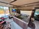 Sunroom with a hot tub, comfortable seating, and access to the pool area, perfect for year-round enjoyment at 1063 Clarke Ct, Castle Rock, CO 80109