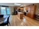 Well-lit kitchen featuring wood cabinets, stainless steel appliances, an island, and an open view to the back yard at 1063 Clarke Ct, Castle Rock, CO 80109