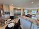 Open kitchen area showcasing stainless steel appliances, granite countertops, and eat-in area at 1063 Clarke Ct, Castle Rock, CO 80109