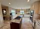 Beautiful kitchen with stainless steel appliances, granite countertops, and large windows overlooking the backyard at 1063 Clarke Ct, Castle Rock, CO 80109