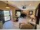 Elegant living room with vaulted ceilings, tile floors, piano, and a view at 1063 Clarke Ct, Castle Rock, CO 80109