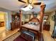 Ornate main bedroom features a beautiful poster bed, skylight, and abundant closet and dresser space at 1063 Clarke Ct, Castle Rock, CO 80109