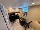 Efficient home office space with built-in cabinets, desk, and seating, ideal for remote work or study at 1063 Clarke Ct, Castle Rock, CO 80109