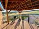 Covered patio with outdoor seating, a grill, and a serene view of the surrounding landscape, ideal for relaxation at 1063 Clarke Ct, Castle Rock, CO 80109