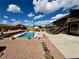 Beautiful backyard with in-ground pool, a patio with furniture, and lush landscaping at 1063 Clarke Ct, Castle Rock, CO 80109