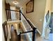 Staircase in neutral tones with a decorative wall hanging at 1063 Clarke Ct, Castle Rock, CO 80109