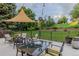 Relaxing backyard patio with ample seating around a fire pit, perfect for outdoor entertaining at 9678 E Powers Dr, Greenwood Village, CO 80111
