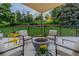 Backyard patio with a modern fire pit and scenic views of the surrounding landscape at 9678 E Powers Dr, Greenwood Village, CO 80111