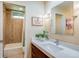 Stylish bathroom featuring a marble vanity, modern fixtures, and tiled shower/tub combo at 9678 E Powers Dr, Greenwood Village, CO 80111