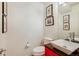 Modern powder room with a unique vanity, sink, and fixtures at 9678 E Powers Dr, Greenwood Village, CO 80111