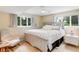 This bedroom is brightly lit with natural light and has decoratively designed furnishings at 9678 E Powers Dr, Greenwood Village, CO 80111