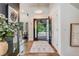 Elegant foyer with hardwood floors, modern lighting, and decorative accents, creating a welcoming entrance at 9678 E Powers Dr, Greenwood Village, CO 80111