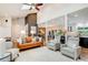 Bright and open living room with stylish furnishings and hardwood floors at 9678 E Powers Dr, Greenwood Village, CO 80111