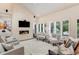 Comfortable living room with a stone fireplace, lots of natural light, and modern decor at 9678 E Powers Dr, Greenwood Village, CO 80111
