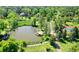 This aerial view highlights a pond with a dock at 9678 E Powers Dr, Greenwood Village, CO 80111