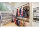 Spacious walk-in closet with abundant shelving, rods, and storage solutions for optimal organization at 9678 E Powers Dr, Greenwood Village, CO 80111