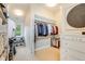 Organized walk-in closet with ample shelving, hanging rods, and storage drawers at 9678 E Powers Dr, Greenwood Village, CO 80111