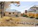 Backyard of property with wooden deck and landscaping at 1171 Quebec St, Denver, CO 80220