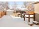 Spacious backyard with a detached garage and wooden fence at 1171 Quebec St, Denver, CO 80220