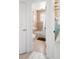 Clean bathroom with beige tile, shower/tub combo, and a brown bathmat at 1171 Quebec St, Denver, CO 80220