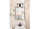 Bathroom featuring modern light fixture above the vanity, next to the shower and tub at 1171 Quebec St, Denver, CO 80220